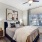 The Monaco at Waterford Lakes, Orlando, Florida bedroom with woo-style flooring, ceiling fan and large windows